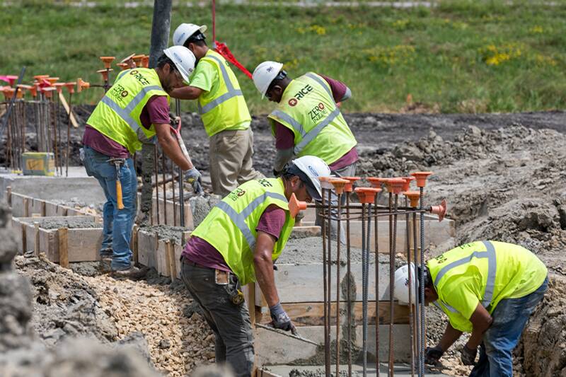 Workers going through equipment and other