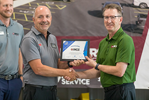 Men shaking hands and presenting certificate