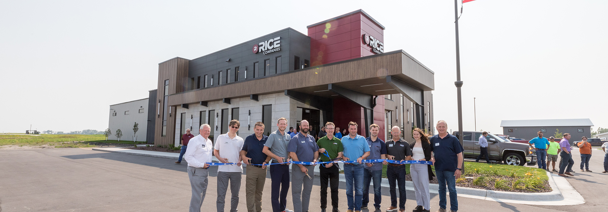 Line of professionals at ribbon cutting