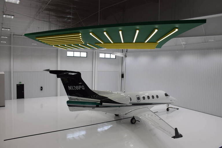 Airport hangar interior with airplane