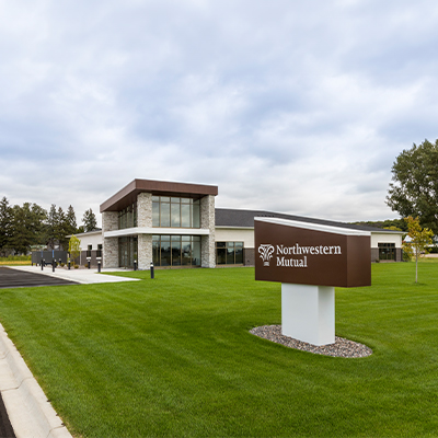 Modern office building exterior with sign