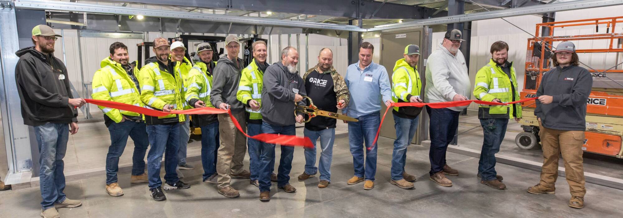 Training Center Ribbon Cutting Construction Employees Group